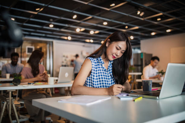 istock Woman in modern office 1204018259