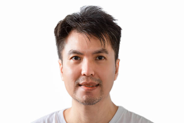 istock smiling asian young handsome man. isolated on white 1204019023