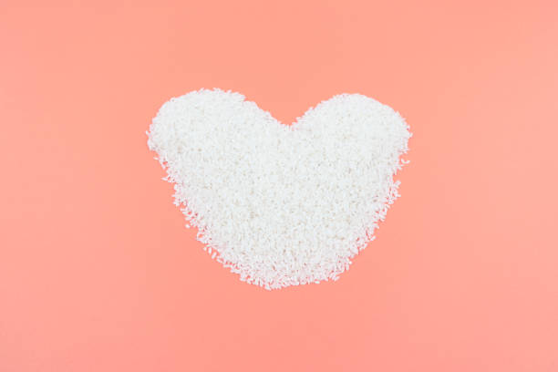 Cooked basmati rice served in a ceramic bowl or plate on white background.