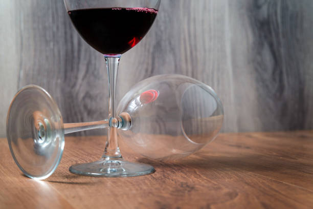 istock Two wine glasses on wooden background 1204019295