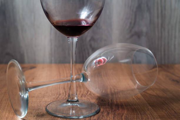 istock Two wine glasses on wooden background 1204019311