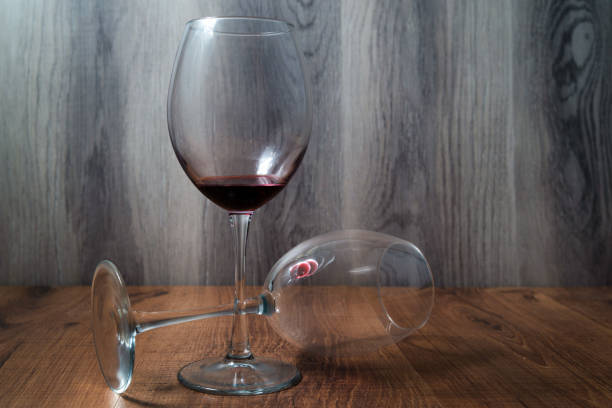 istock Two wine glasses on wooden background 1204019404