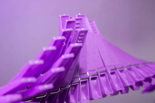 istock Plastic clothespins on the line in wave form 1204020575