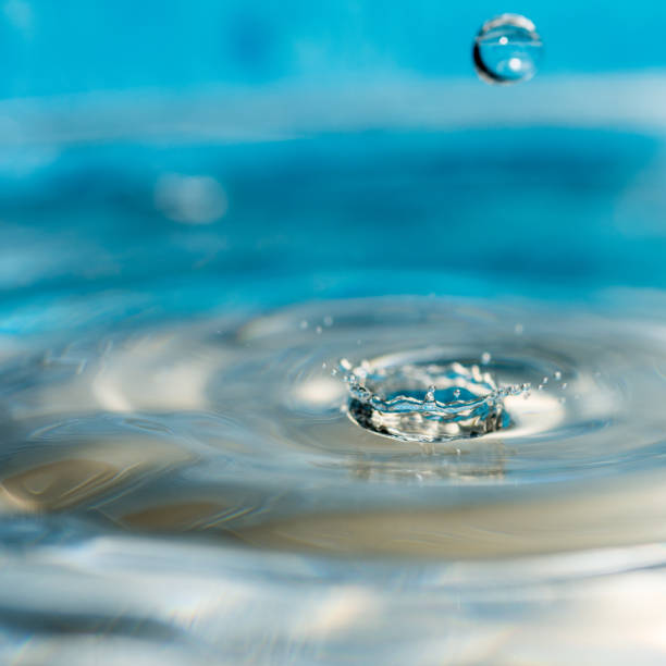 istock close up conceptual photo of water drops splashing 1204020754