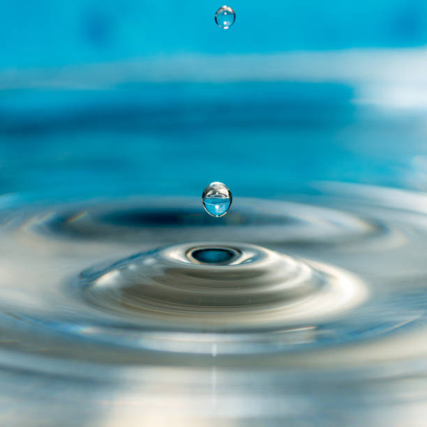 istock close up conceptual photo of water drops splashing 1204020755