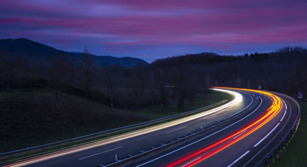 istock Car lights on the highway at night, Gipuzkoa 1204020780
