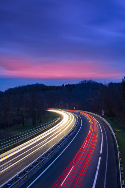 istock Car lights on the highway at night, Gipuzkoa 1204020839
