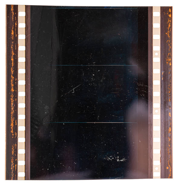 real macro photo of original 70mm film material or strip on white background with empty exposed frames or cells large format 70mm film material on white, cinefilm detail absence photos stock pictures, royalty-free photos & images