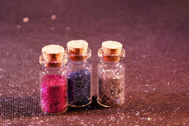 istock Glass bottles photographed in the studio with colored foils before the flashes 1204025857
