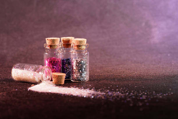 istock Glass bottles photographed in the studio with colored foils before the flashes 1204025963