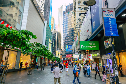 his pic shows Nathan Road Hong Kong at evening time. The pic shows lots of tourists in street and evening clouds.