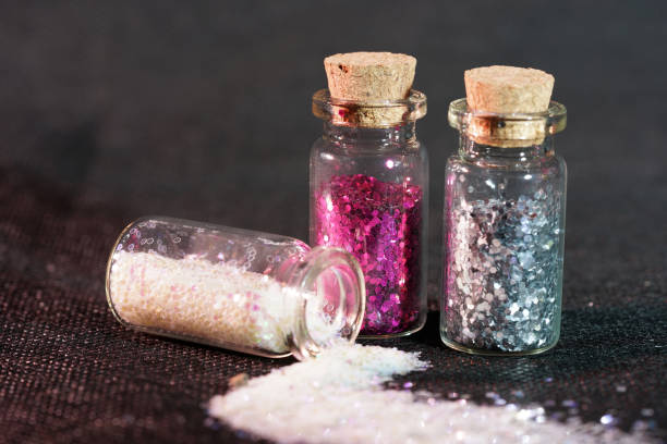 istock Glass bottles photographed in the studio with colored foils before the flashes 1204026971