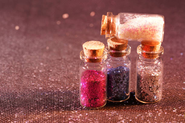 istock Glass bottles photographed in the studio with colored foils before the flashes 1204026975