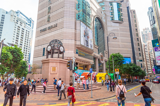 This pic shows  Busy street with advertising signs in Times Square 1 Matheson Street, Causeway Bay, Hong Kong at Day. Times Square is a major shopping centre and office tower complex in Causeway Bay, Hong Kong.