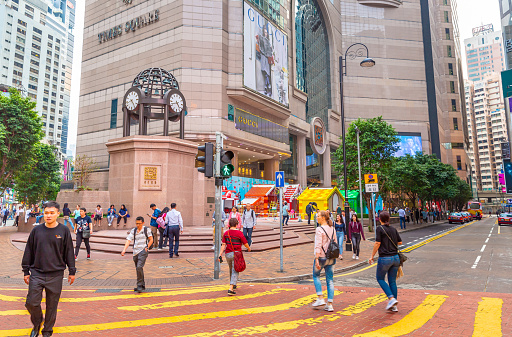 This pic shows  Busy street with advertising signs in Times Square 1 Matheson Street, Causeway Bay, Hong Kong at Day. Times Square is a major shopping centre and office tower complex in Causeway Bay, Hong Kong.