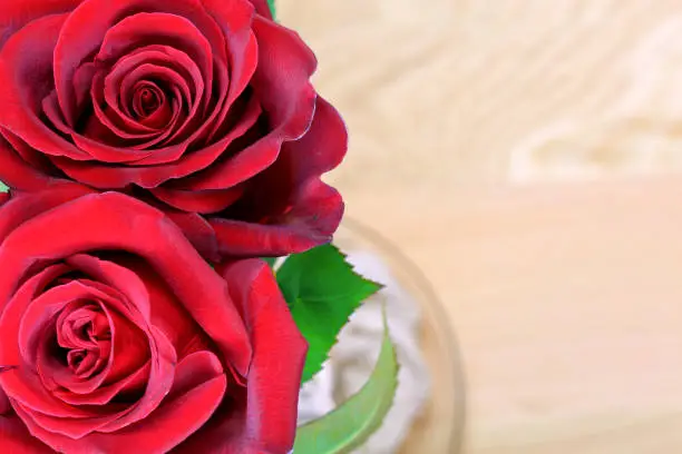 Valentine's day red roses over wood background, horizontal, Copy Space