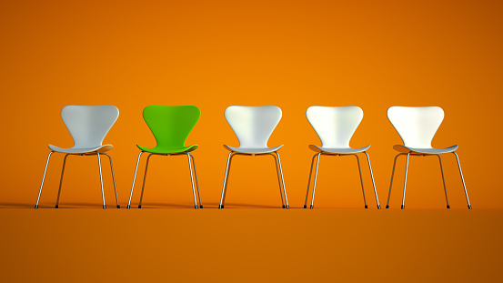 3D rendering of a row of plastic and metal chairs in green with a contrasting red one on an orange  background