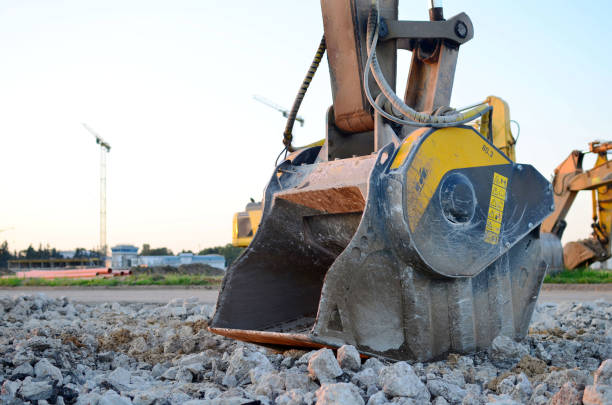 istock Excavator with crusher bucket for crushing concrete 1204030753