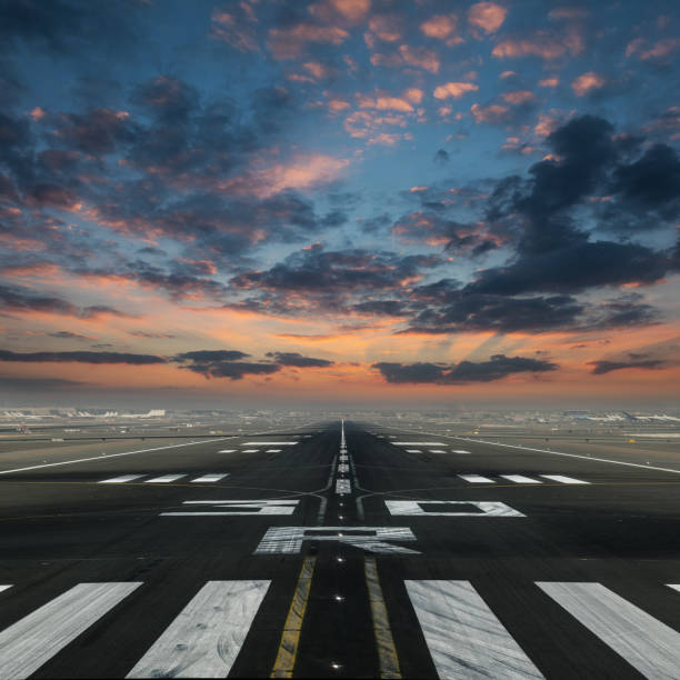 istock airport runway with cloudy sky 1204030796