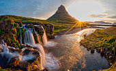 Beautiful landscape with sunrise on Kirkjufellsfoss waterfall and Kirkjufell mountain, Iceland.