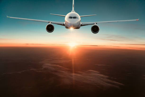 istock Commercial airplane jetliner flying above dramatic clouds. 1204030977