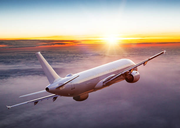 istock Commercial airplane jetliner flying above dramatic clouds. 1204030993