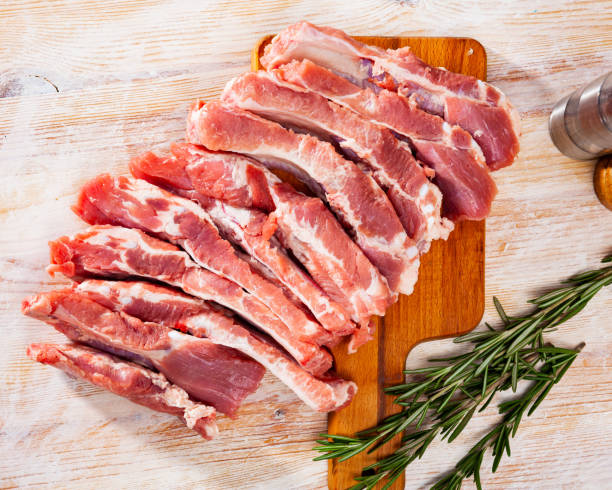 istock Raw pork ribs on wooden table 1204032502