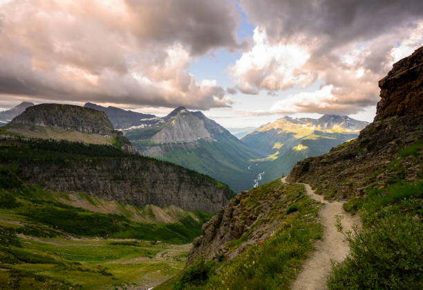 istock Woman Jumps On Highline Trail On Cloudy Day 1204033242