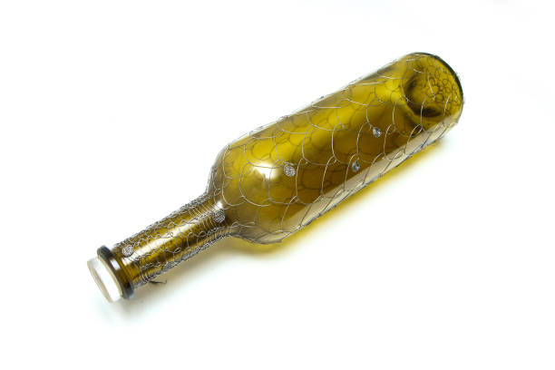 The wire brushed wine bottle.  The traditional decorative craft. In a white background.