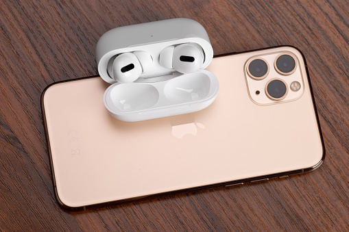 Airpods Pro And Iphone 11 Pro A Wooden Stock Photo - Download Image Now -