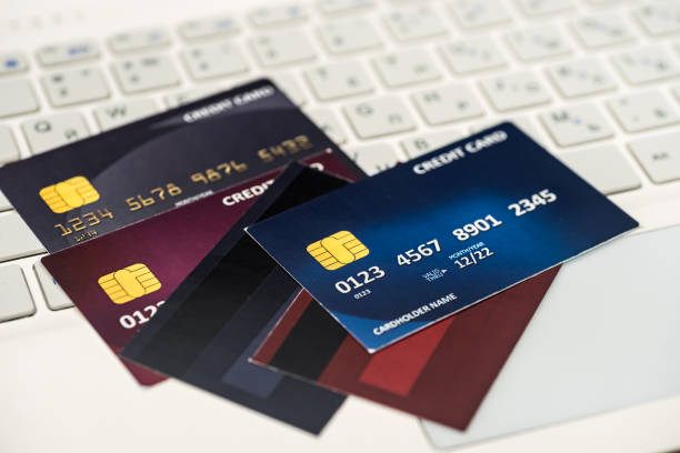 istock credit card on laptop. shopping concept. 1204039263