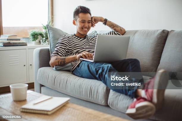 Watching New Classes On Laptop Stock Photo - Download Image Now - Achievement, Adult, Adults Only