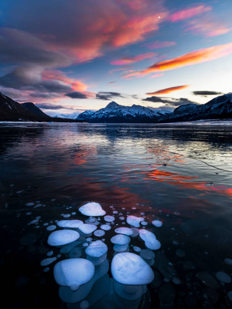istock ice bubble and sunrise at Abraham Lake 1204041583