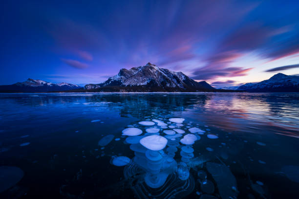 istock ice bubble and sunrise at Abraham Lake 1204041674