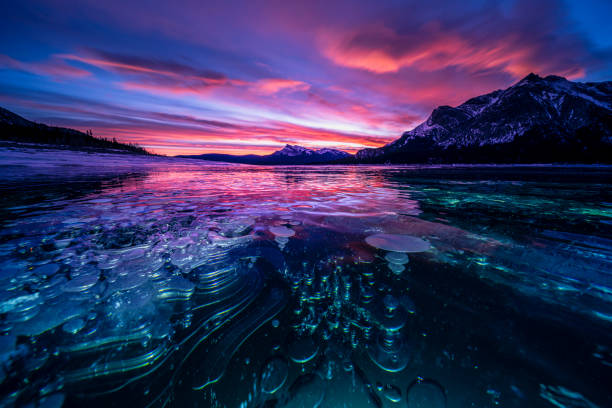 istock ice bubble and sunrise at Abraham Lake 1204042234