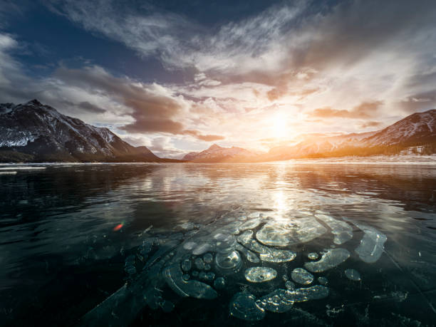 istock ice bubble and sunrise at Abraham Lake 1204042312