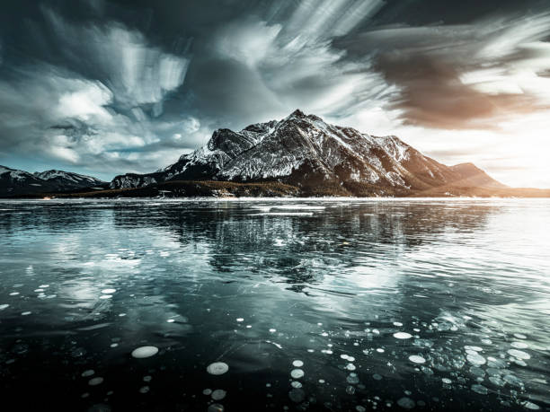 ice bubble and sunrise at Abraham Lake, alberta, canada.