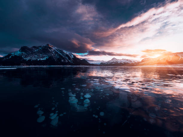 istock ice bubble and sunrise at Abraham Lake 1204042341