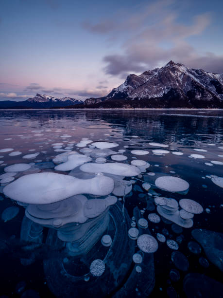 istock ice bubble and sunrise at Abraham Lake 1204042451