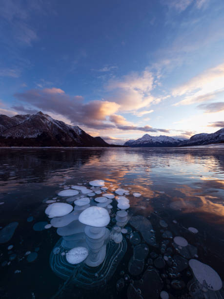 istock ice bubble and sunrise at Abraham Lake 1204042653