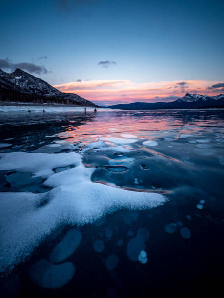 istock ice bubble and sunrise at Abraham Lake 1204042687