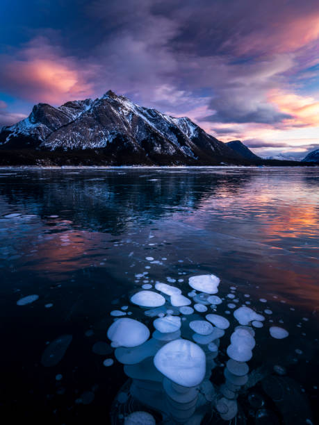istock ice bubble and sunrise at Abraham Lake 1204042786