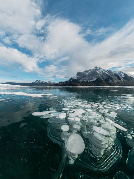 istock ice bubble and sunrise at Abraham Lake 1204042806