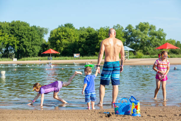 istock Family At Swimming Beach On Summer Day 1204042864