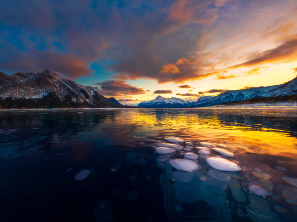istock ice bubble and sunrise at Abraham Lake 1204042867