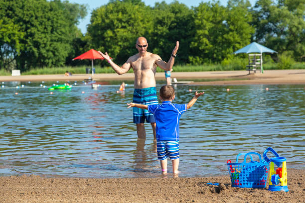 istock Father & Son at Beach on Summer Day 1204042871