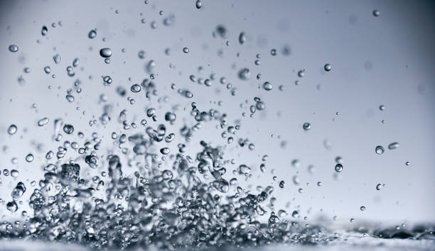 istock abstract falling drops of water on a light background close-up 1204044815