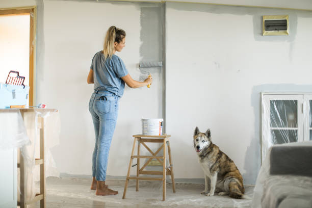 istock Woman doing diy project in apartment 1204045961