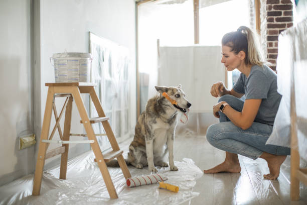 istock Woman doing diy project in apartment 1204045965