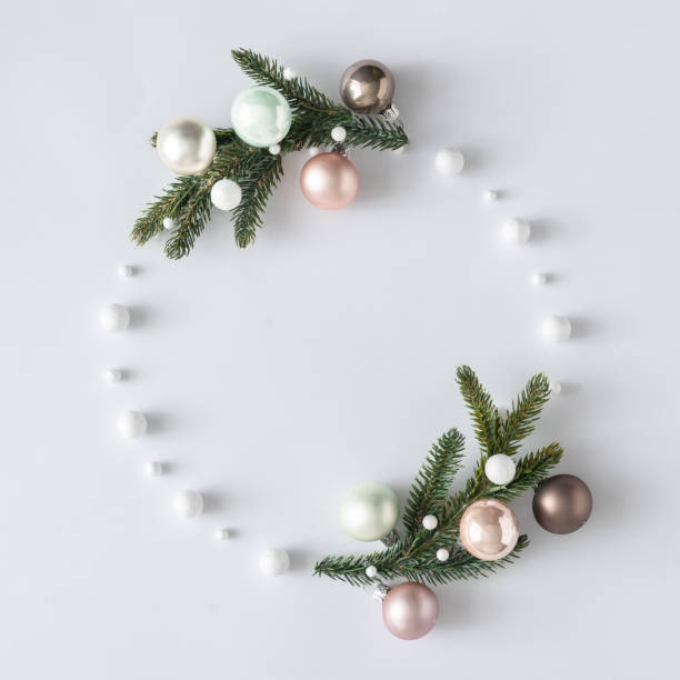 istock Natural Christmas wreath with green pine tree branches and ball decoration. 1204045991